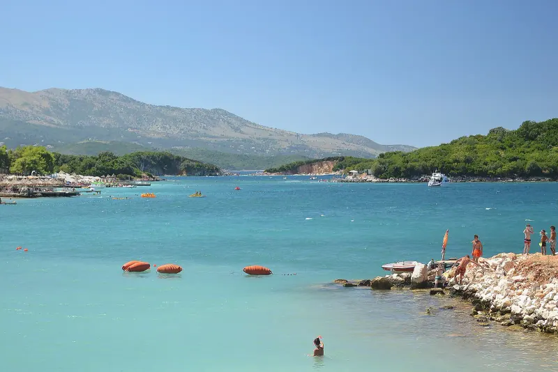 Turquoise shallow water and small islands off the beach at Ksamil on the Albanian Riviera