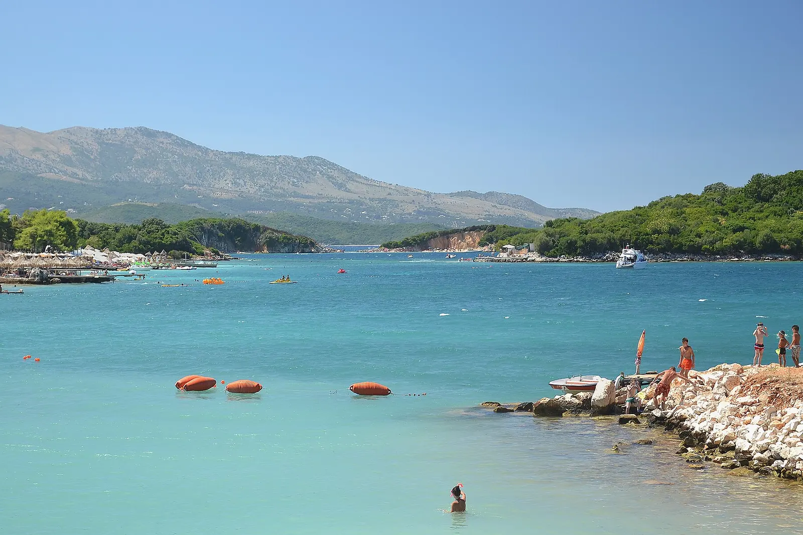 Turquoise shallow water and small islands off the beach at Ksamil on the Albanian Riviera