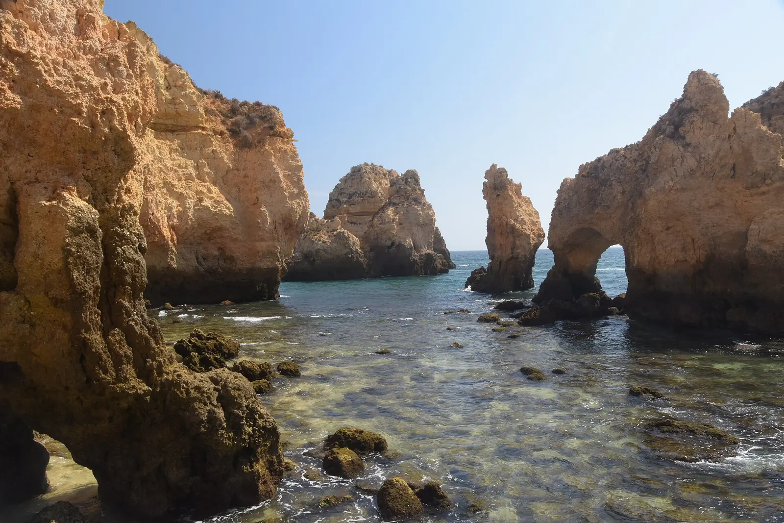 Golden sea stacks and a rock arch at Ponta da Piedade near Lagos in the Algarve