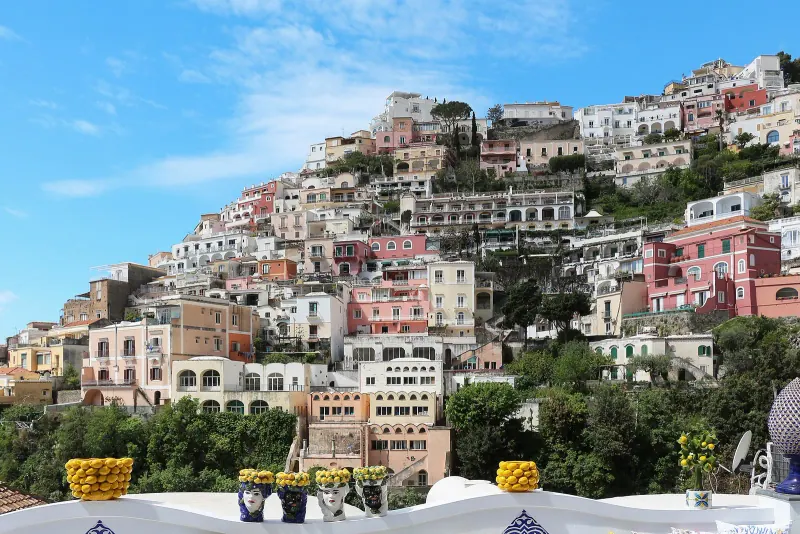 Colorful houses of Positano stacked on the cliff above the sea