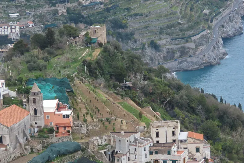 Terraced hillsides and a village above the sea on the Amalfi Coast