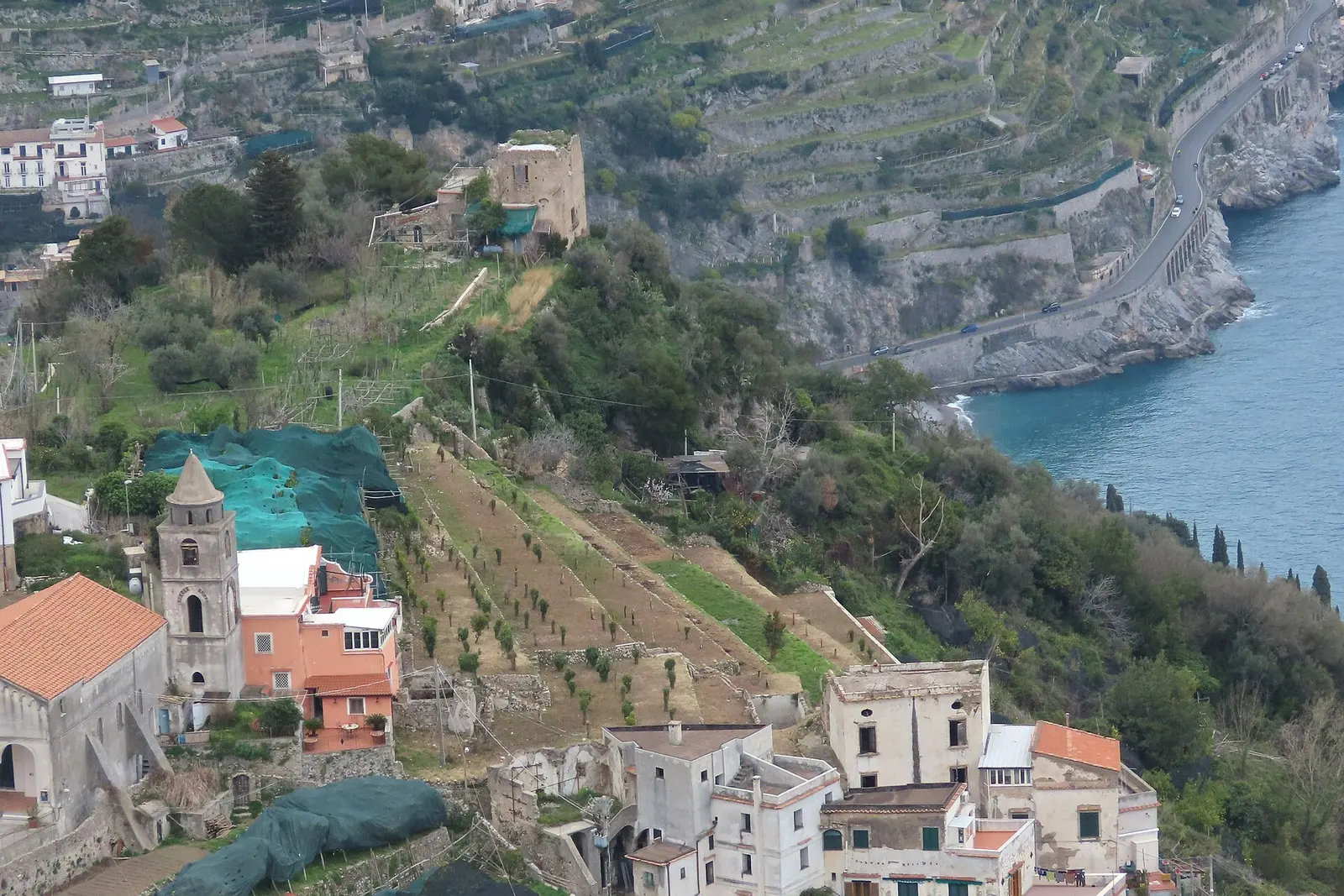 Terraced hillsides and a village above the sea on the Amalfi Coast