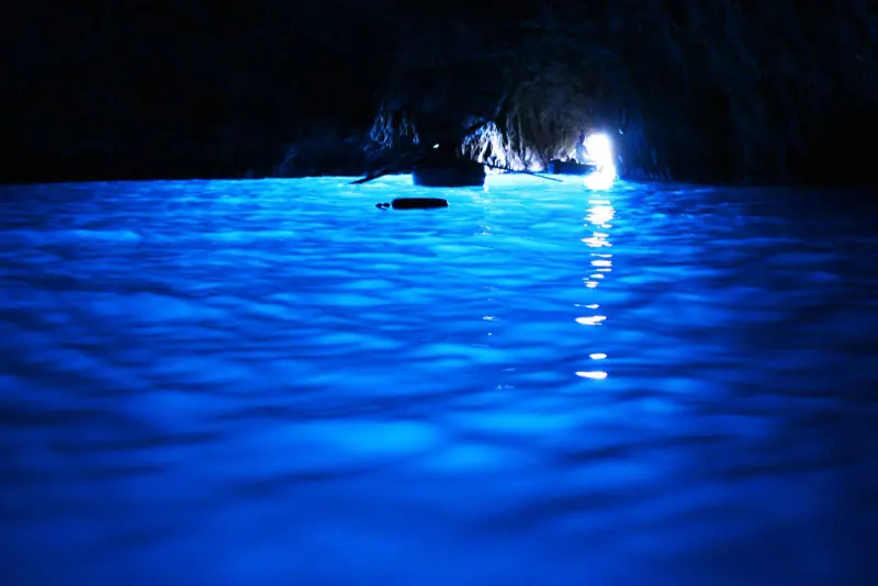 Glowing blue water inside the Blue Grotto on Capri