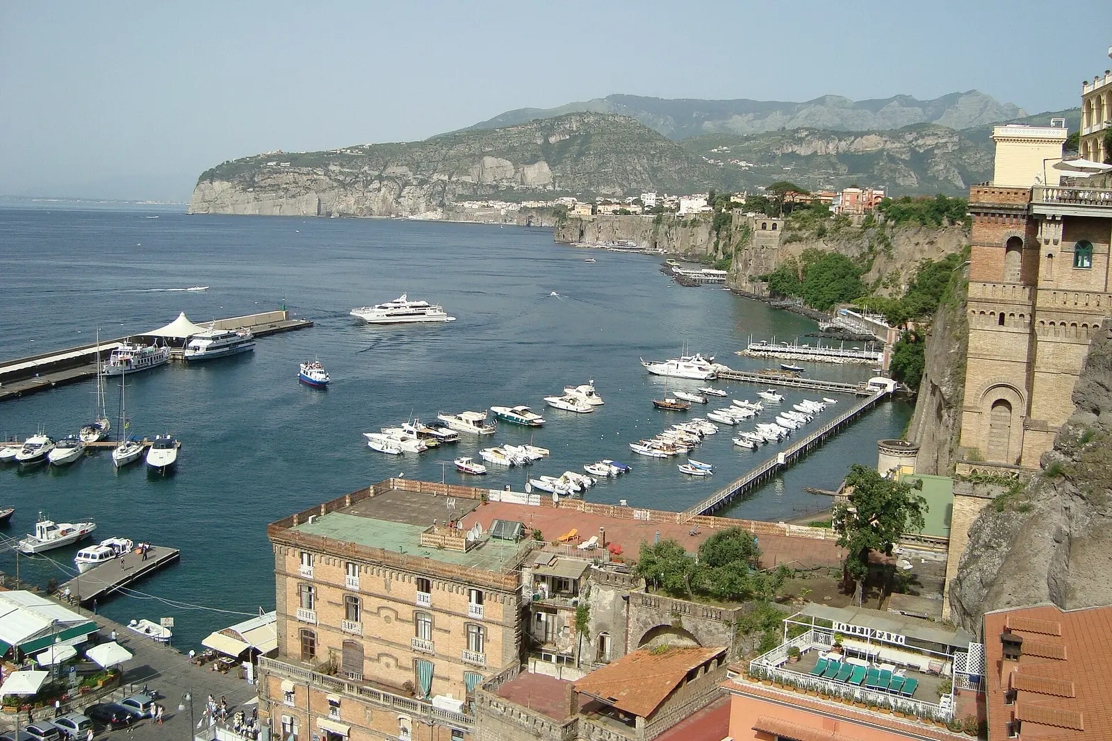Sorrento harbor with boats below the cliffs