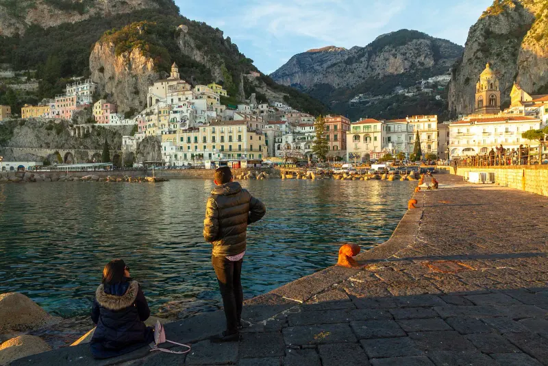 Amalfi town and its harbor below the mountains
