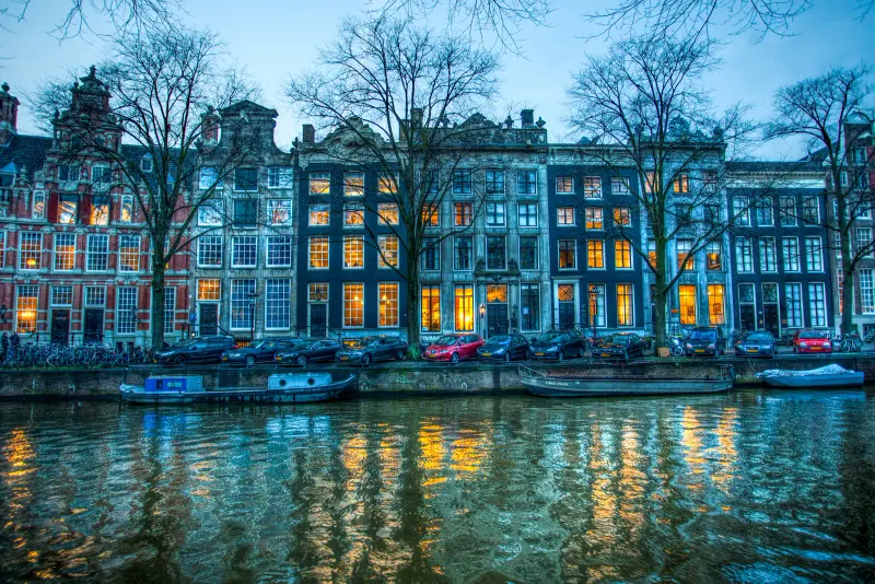 Canal houses on the Herengracht lit at blue hour