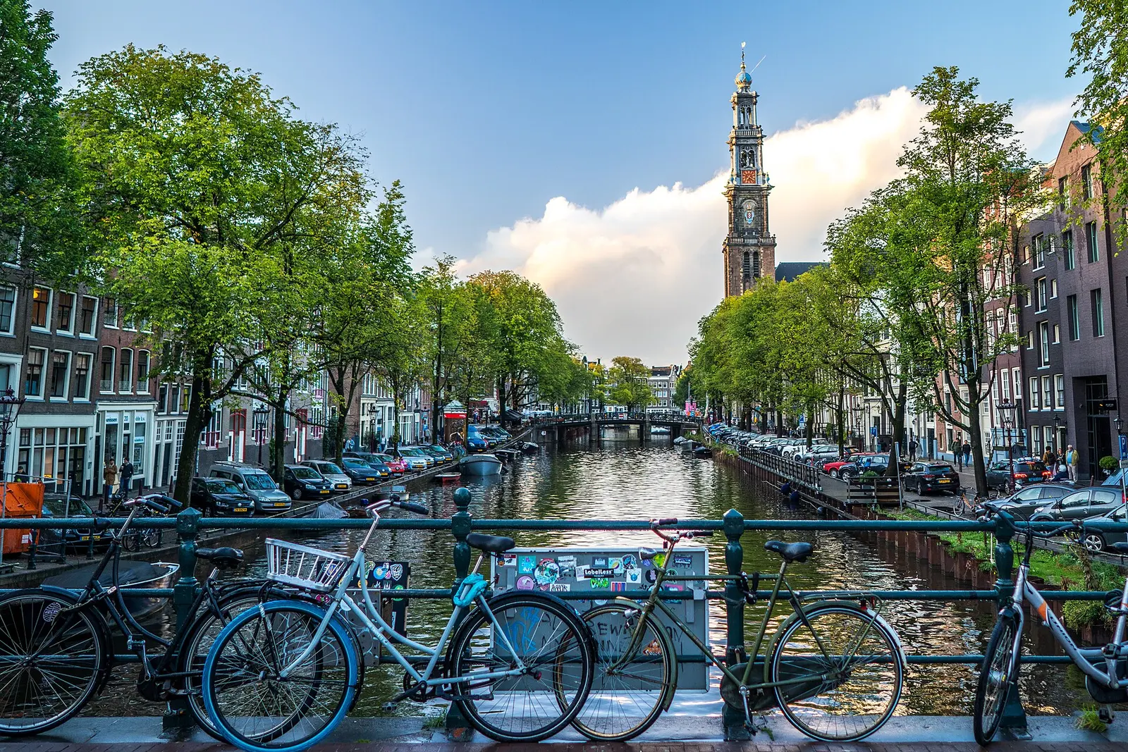 Bicycles parked along an Amsterdam canal railing