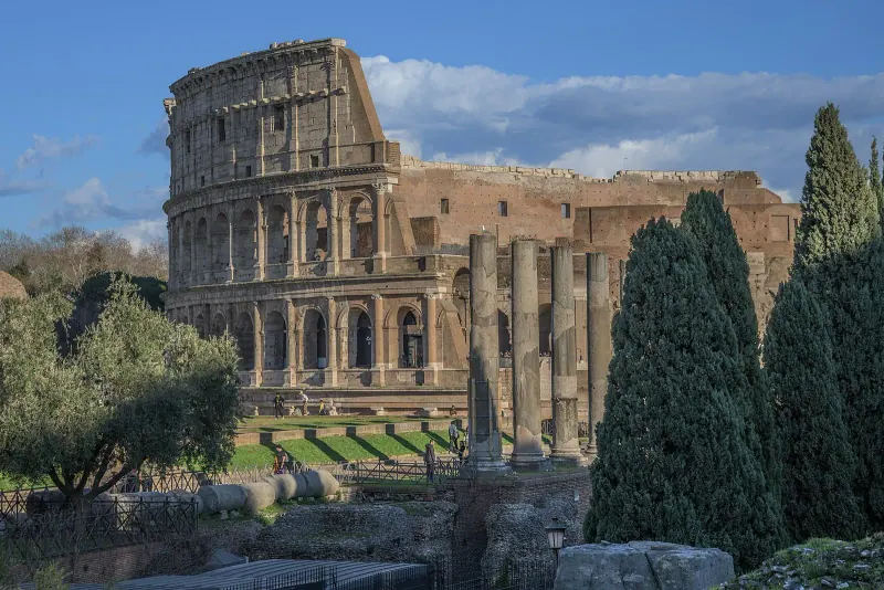 The Colosseum in Rome under a clear sky