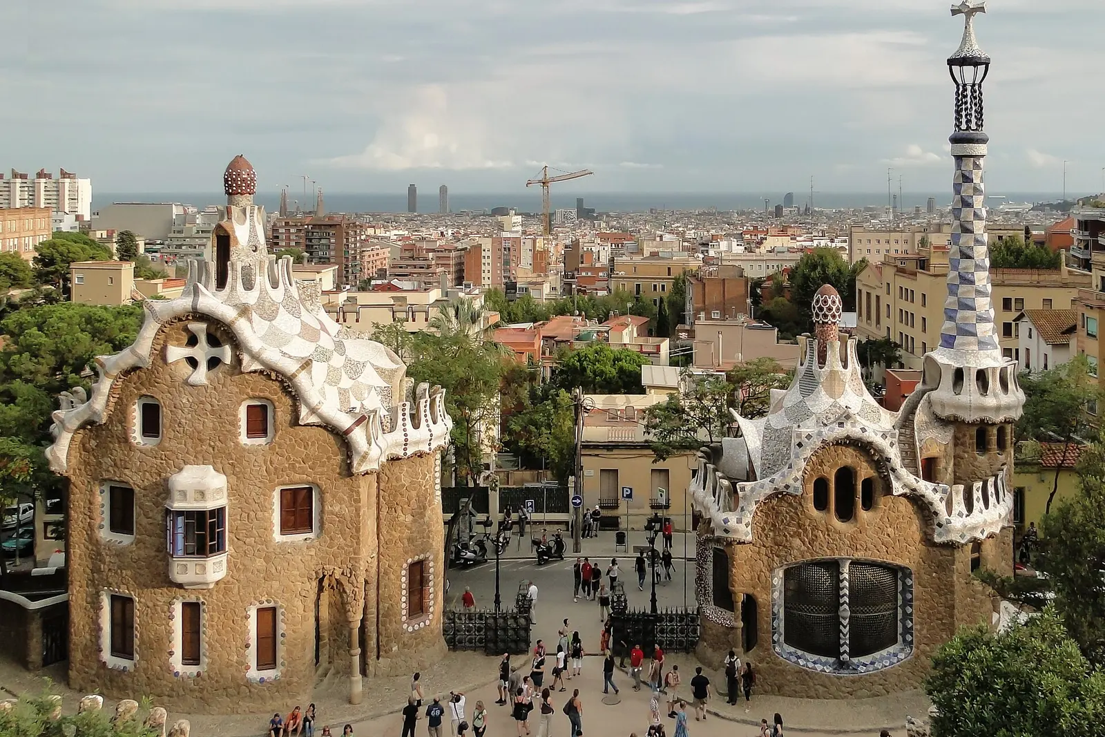 The gatehouses of Park Güell with Barcelona behind