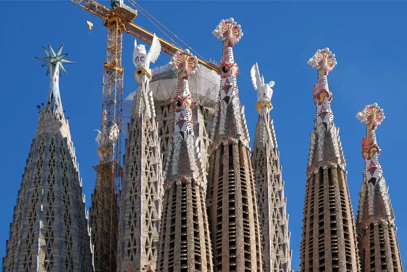 The spires of the Sagrada Família against a blue sky