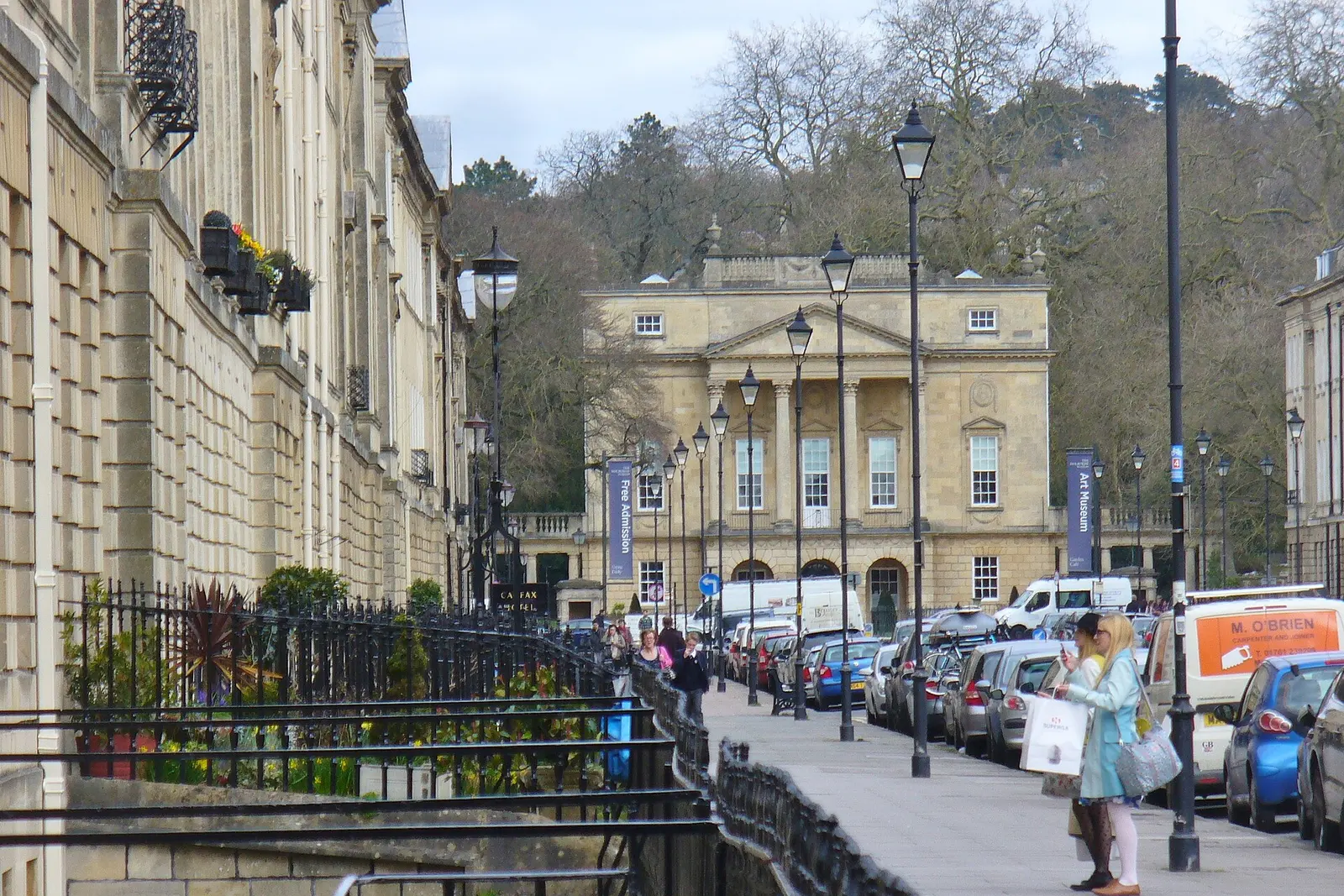 A Georgian limestone street climbing through Bath city centre