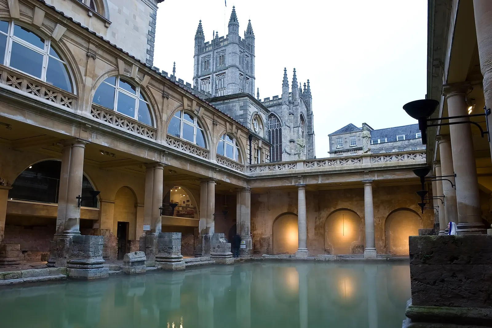 The Great Bath in Bath with Bath Abbey rising behind the colonnade