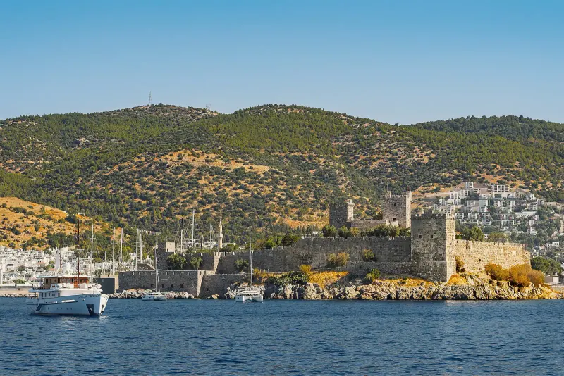 Bodrum Castle on its peninsula with the harbor and hillside town behind