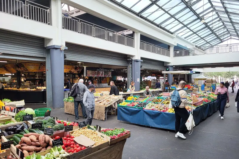 Produce and food stalls inside the Marche des Capucins in Bordeaux
