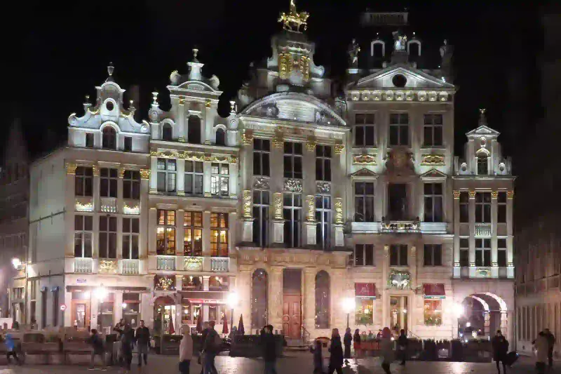 Grand Place guildhalls illuminated at night in Brussels