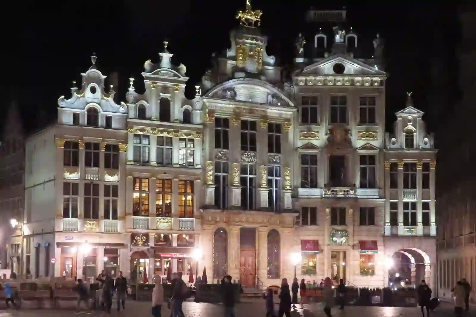 Grand Place guildhalls illuminated at night in Brussels