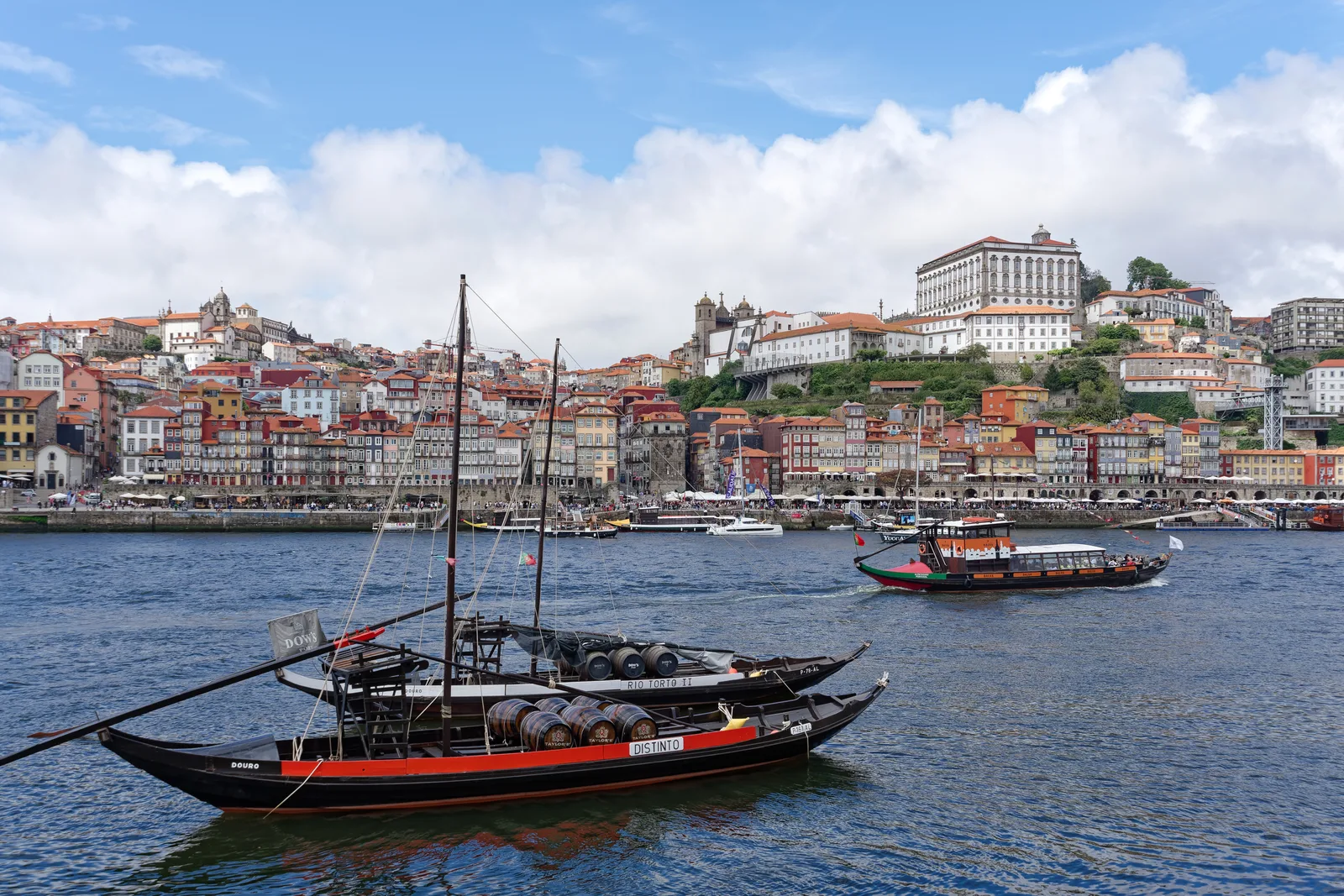 Rabelo boats on the Douro with Porto's Ribeira district and cathedral behind