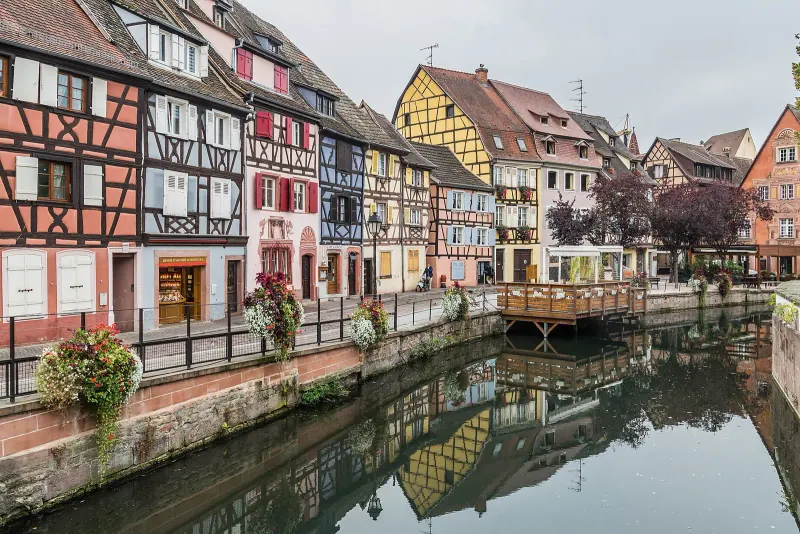 Half-timbered houses reflected in the canal of Petite Venise in Colmar