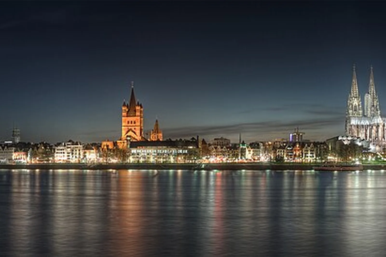 Cologne's old town and cathedral across the Rhine at dusk