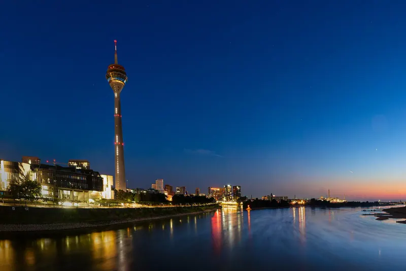 Dusseldorf's Rheinturm and state parliament at dusk