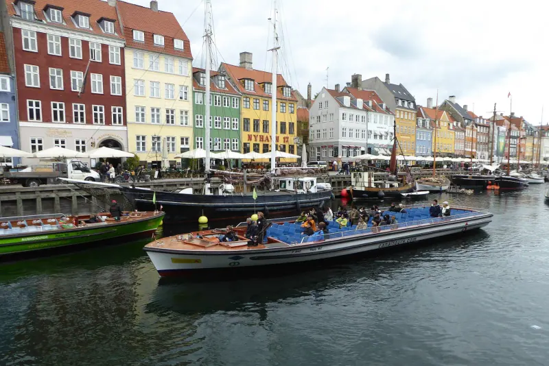 A tour boat passing the colorful houses of Nyhavn