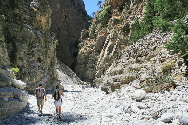 Hikers on the stony floor of Samaria Gorge, Crete