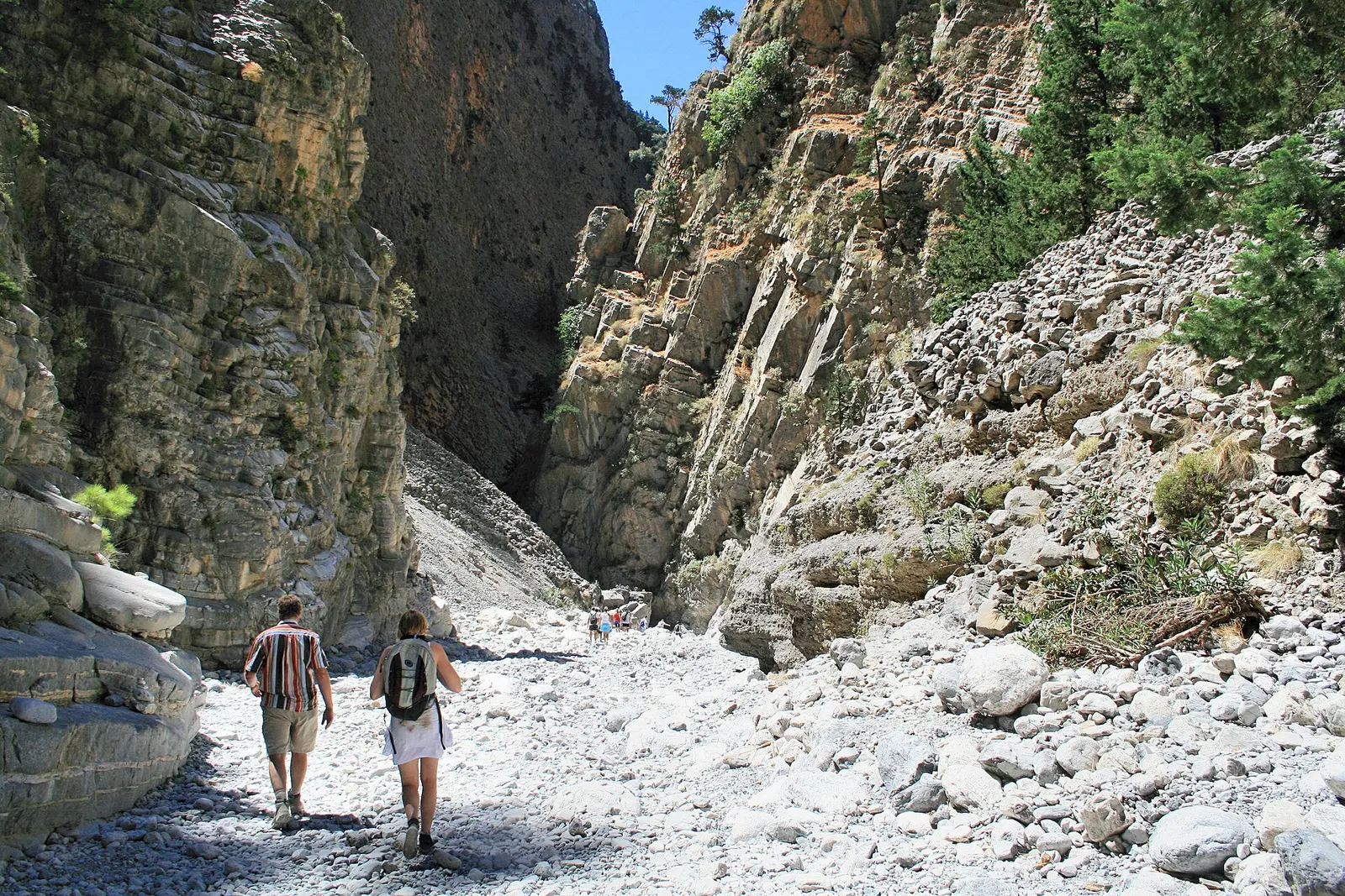 Hikers on the stony floor of Samaria Gorge, Crete