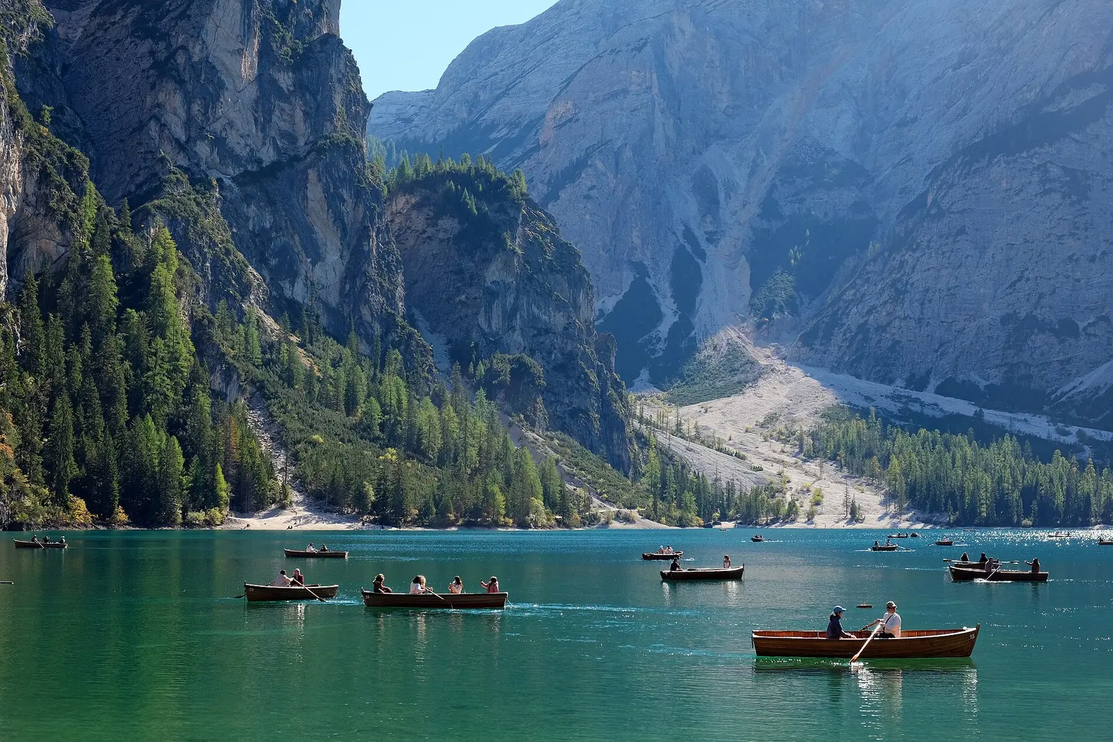 Rowing boats on the green water of Lago di Braies