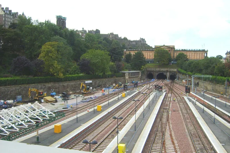 Tracks and platforms at Edinburgh Waverley station below Calton Hill