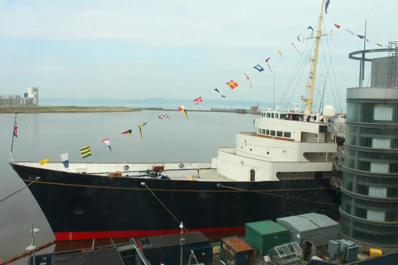 The Royal Yacht Britannia moored at Leith with flags flying