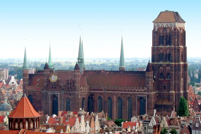 Brick basilica of St Mary rising behind Gdansk rooftops