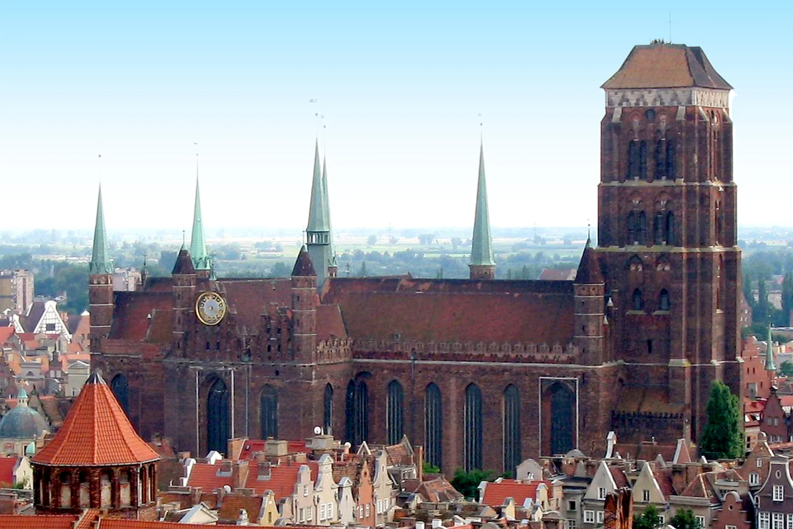 Brick basilica of St Mary rising behind Gdansk rooftops