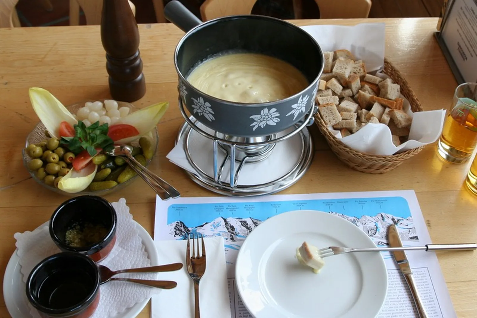 A full Swiss cheese fondue set with bread and salad