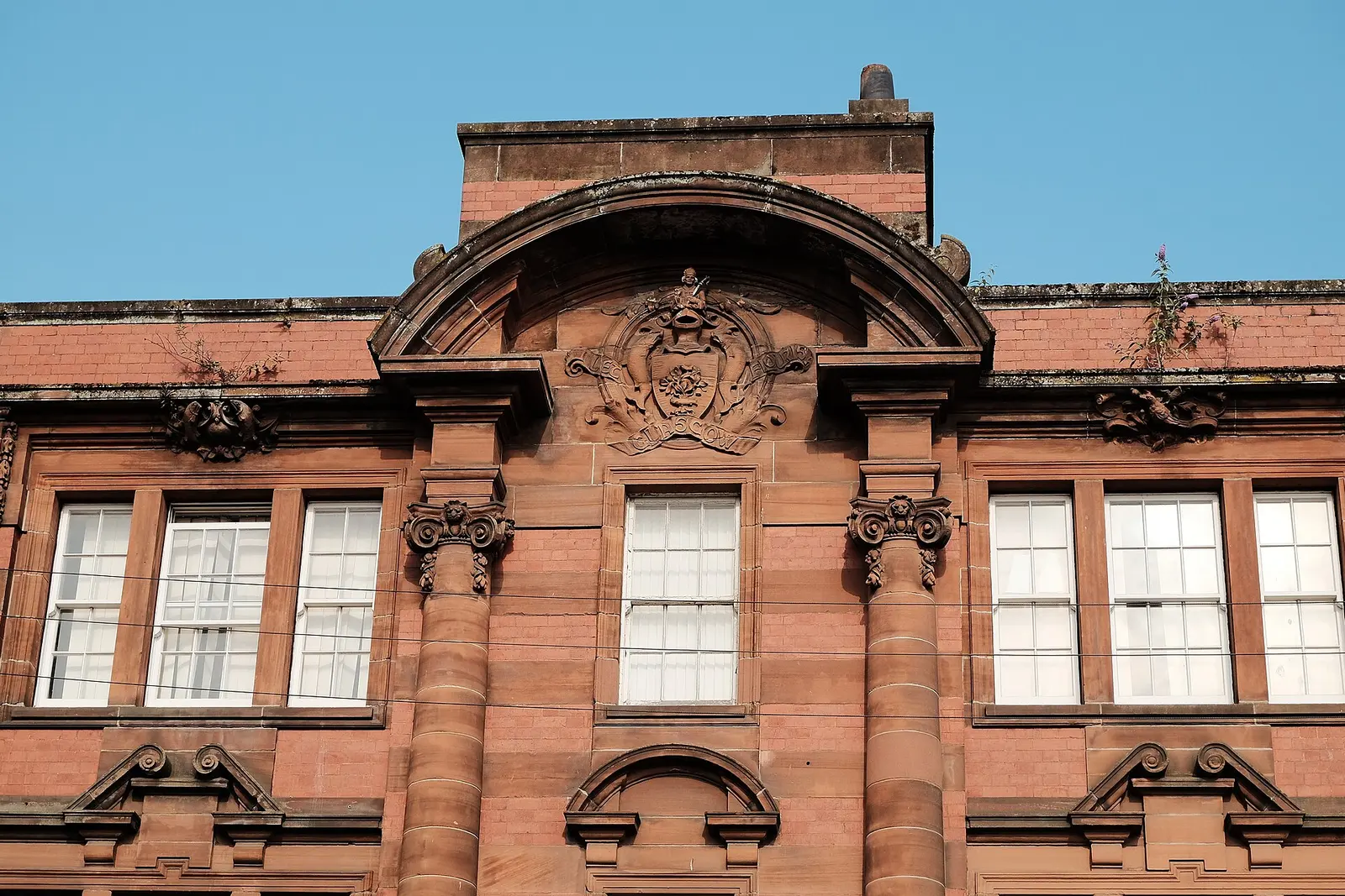 A red sandstone tenement block in Glasgow city centre
