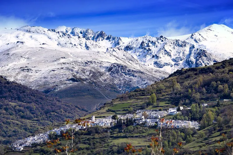 The white village of Capileira under the Sierra Nevada