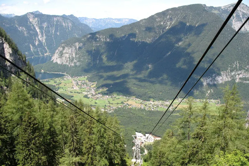 Hallstätter See and the Obertraun valley seen from the Dachstein slopes with cable car lines in the foreground