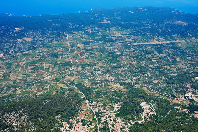 Aerial view of the Stari Grad Plain with its patchwork of fields and the sea beyond