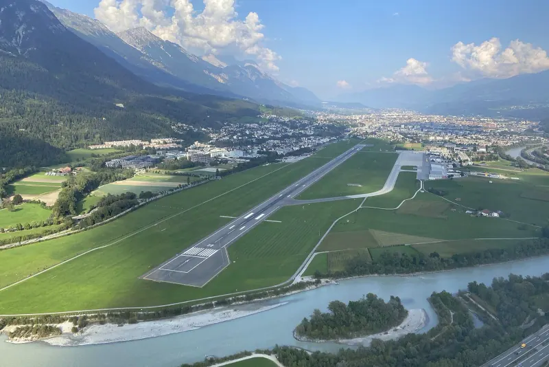Innsbruck airport's runway ringed by Alpine peaks