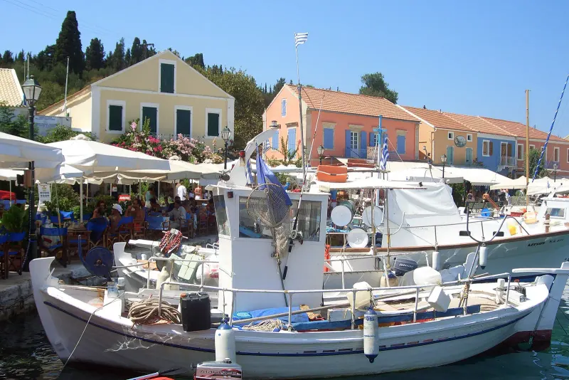 Pastel houses around the harbour of Fiskardo on Kefalonia