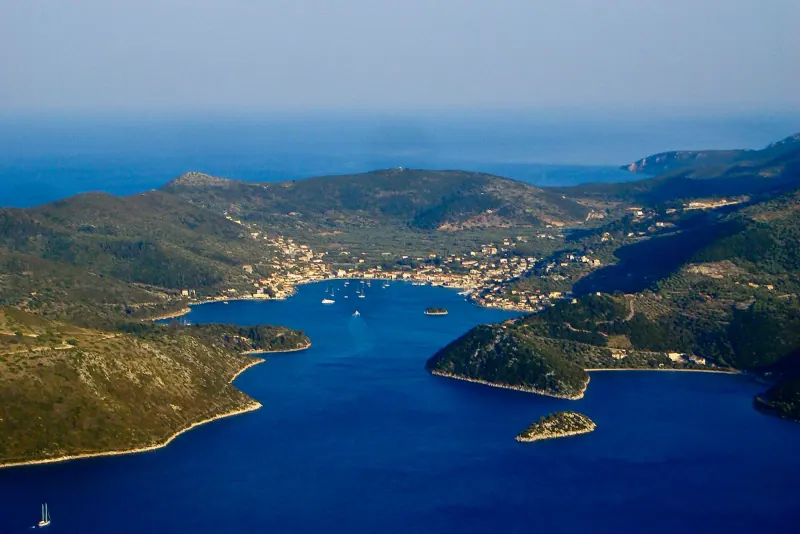The harbour town of Vathy wrapped around its bay on Ithaca