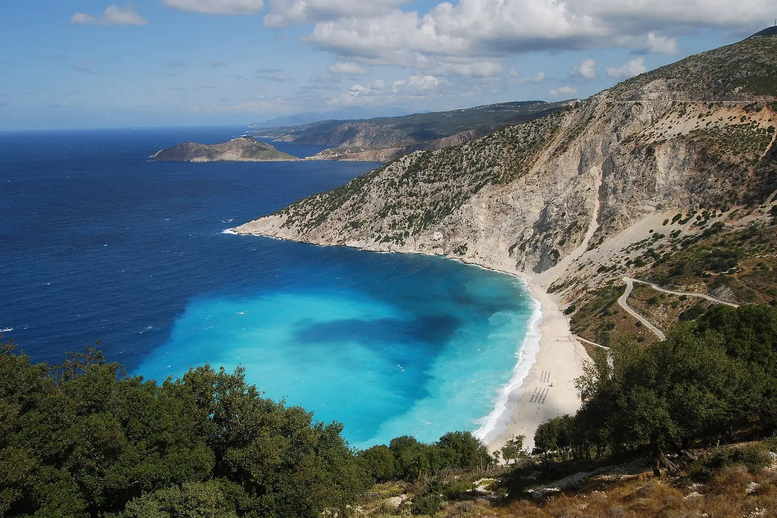 Myrtos Beach curving beneath white limestone cliffs on Kefalonia