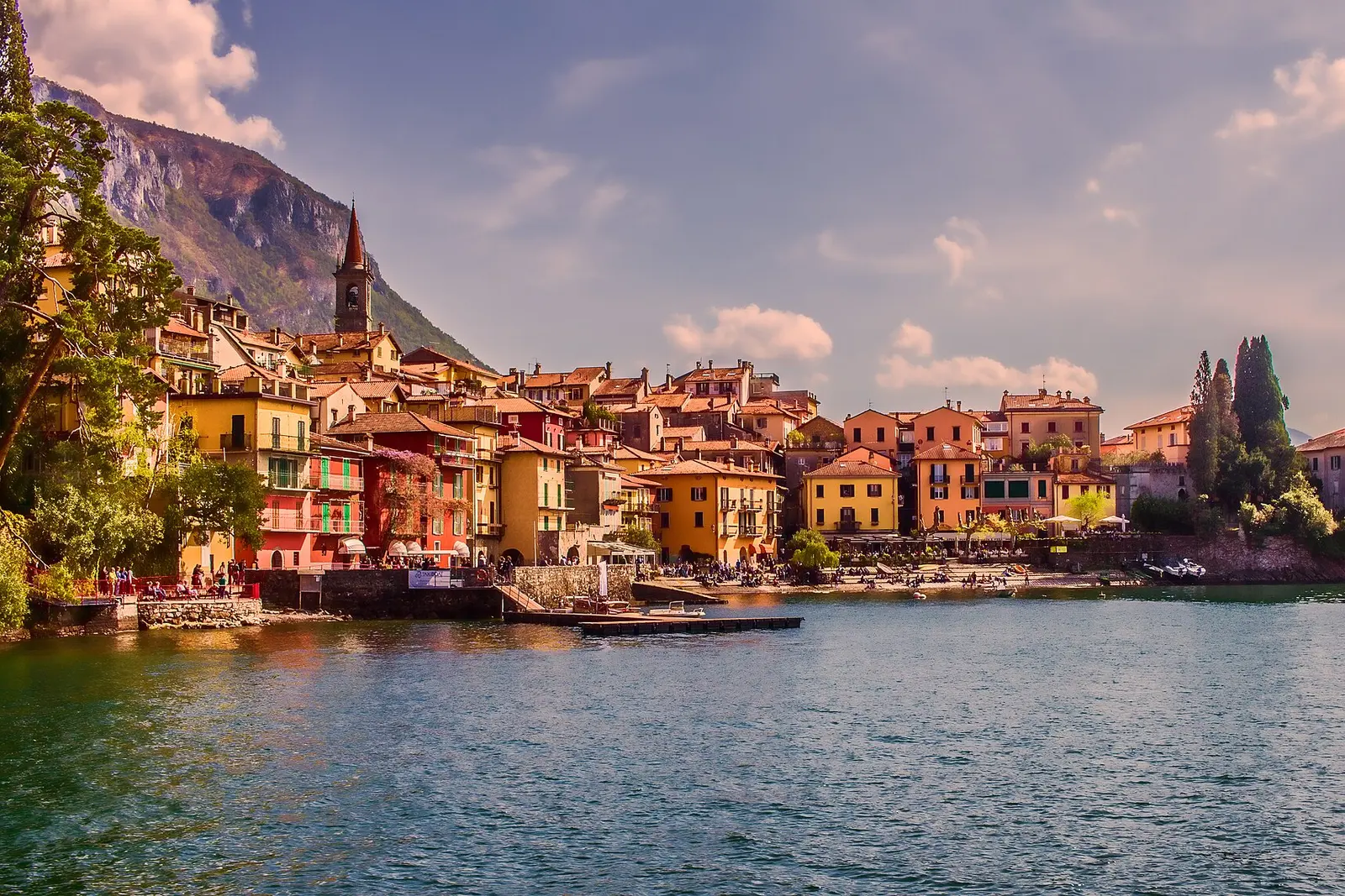 The colorful lakefront houses of Varenna on Lake Como with mountains behind