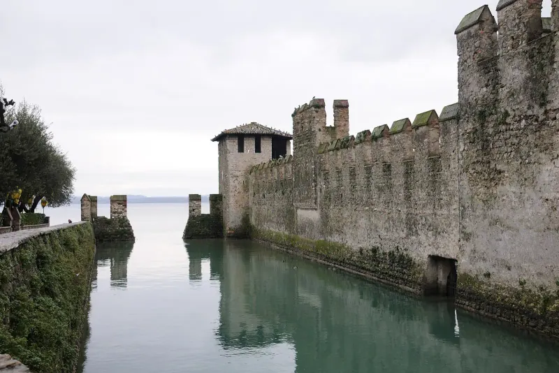The fortified harbor walls of the Scaligero Castle in Sirmione on Lake Garda