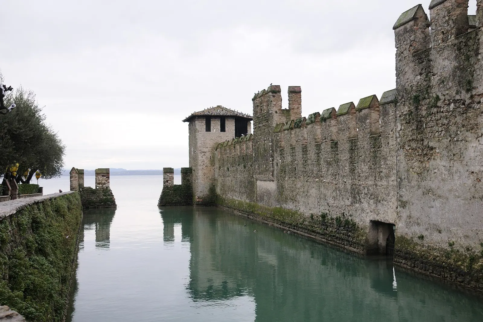 The fortified harbor walls of the Scaligero Castle in Sirmione on Lake Garda