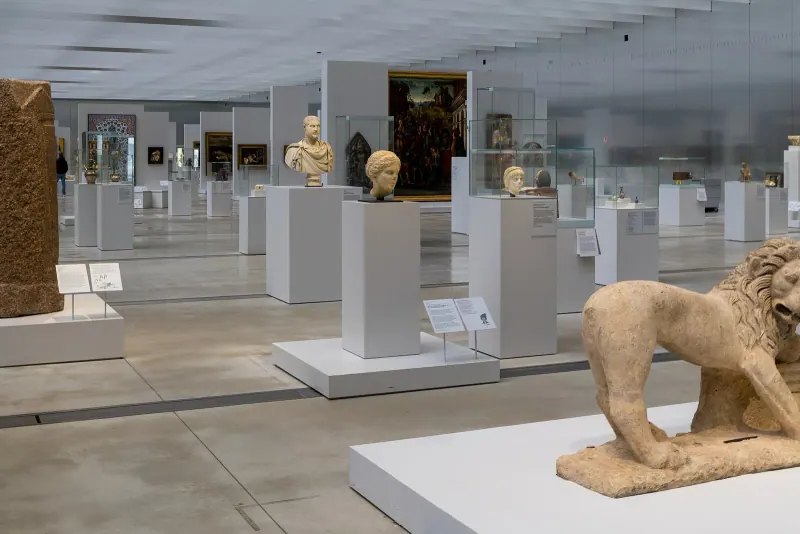 Ancient sculptures inside the Galerie du Temps at the Louvre-Lens