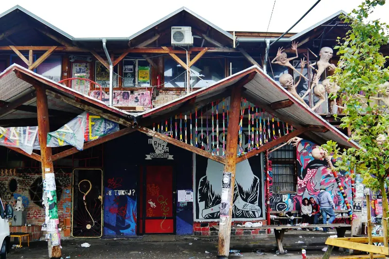A mosaic-covered barracks house in Metelkova