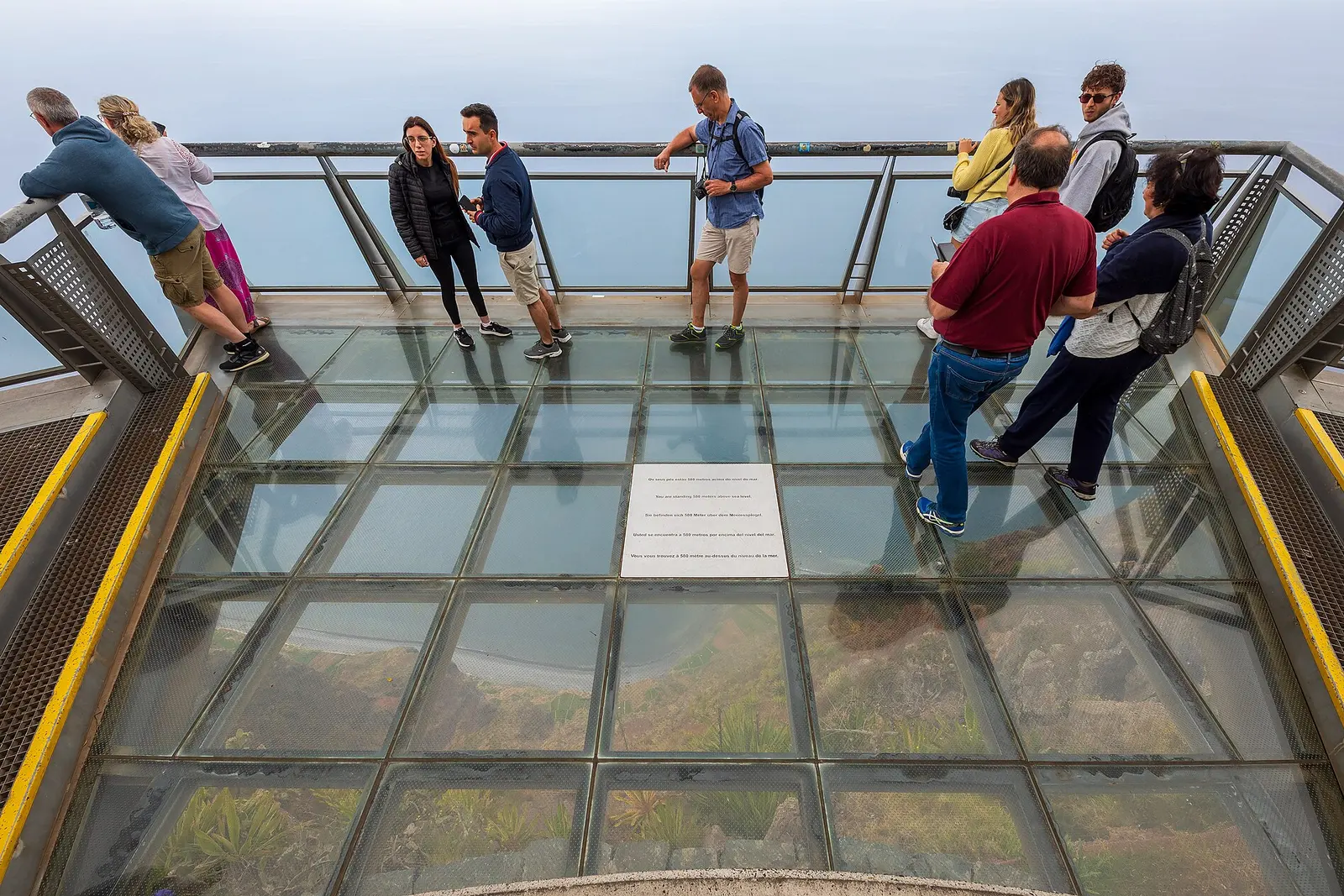 Visitors on the glass platform of the Cabo Girao skywalk