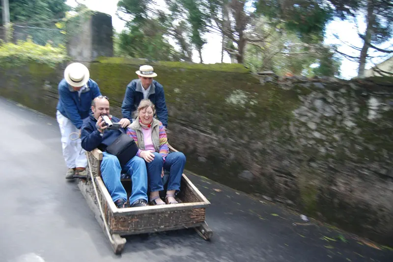 A wicker toboggan sled heading down Monte's streets