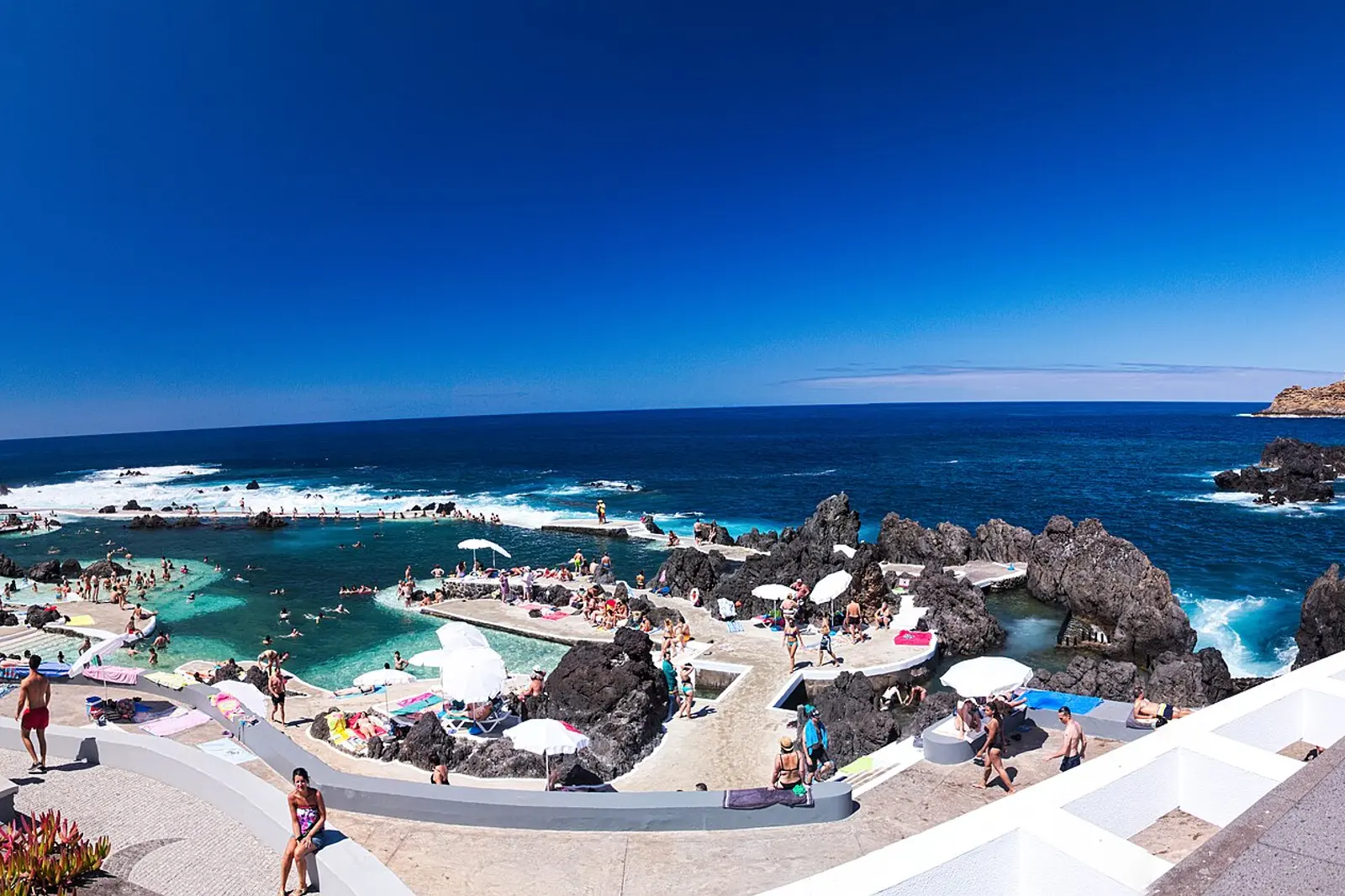 Swimmers in the natural lava pools at Porto Moniz
