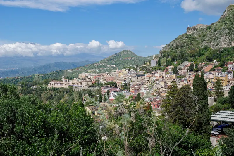 The hillside town of Taormina with Mount Etna beyond